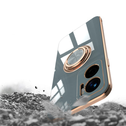 White phone case with gold magnetic ring holder; camera cutouts visible