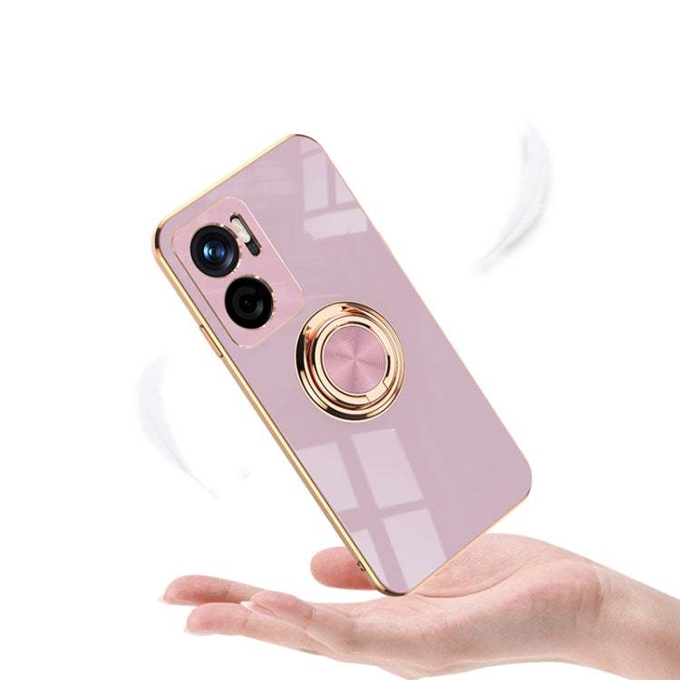 Light pink phone case with gold magnetic ring holder; camera lenses exposed