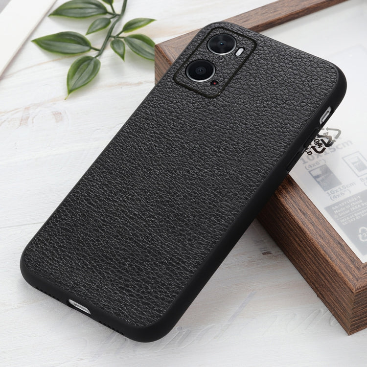 Black litchi-texture genuine leather phone case, angled view with camera cutouts