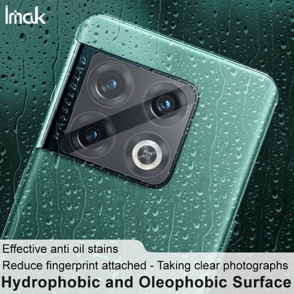 Clear rear camera lens tempered glass film on teal phone back, droplets on surface