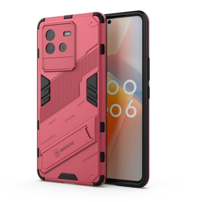 Pink rugged phone case with armor pattern and camera cutouts for iQOO Neo6