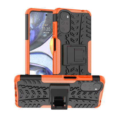 Orange and black textured phone case with built-in holder and raised camera frame