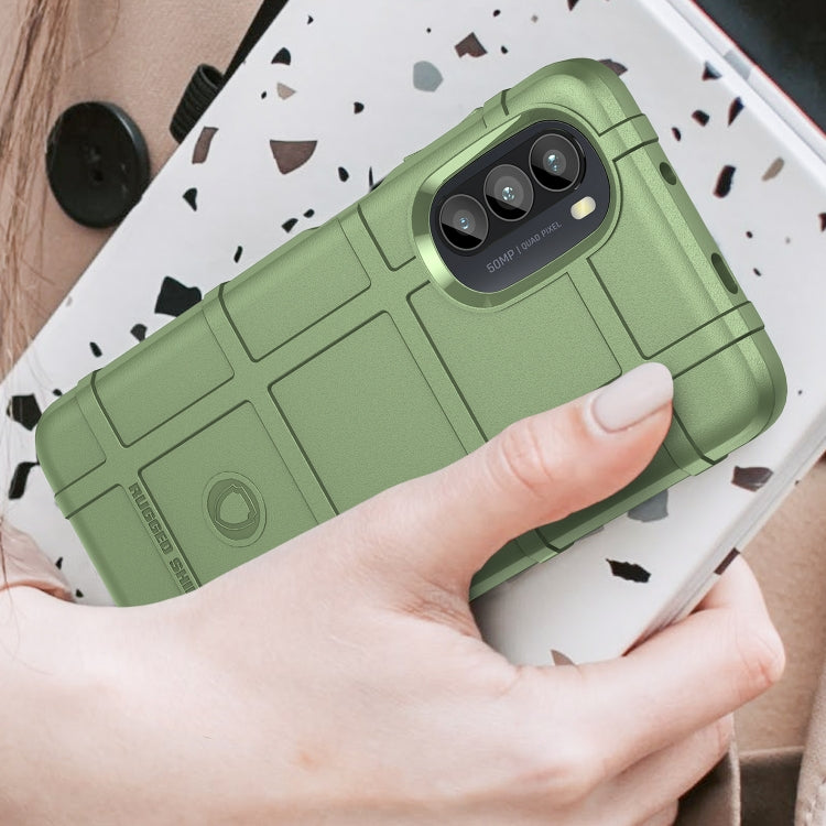 Green rugged TPU phone case with textured grip, camera cutout, and raised edges