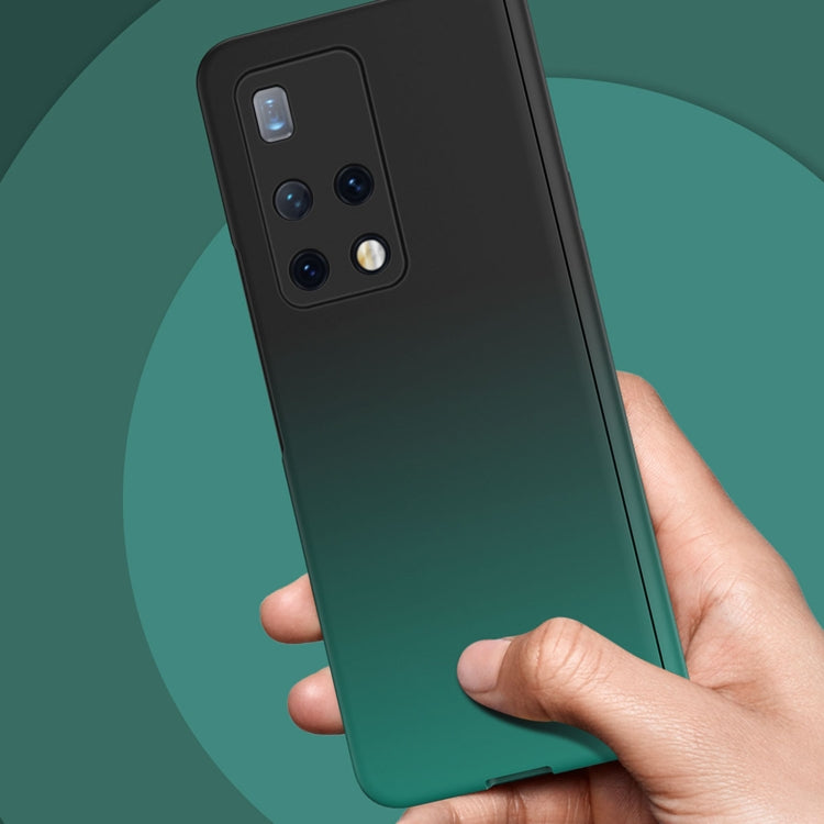 Dark green gradient foldable phone case held in hand with camera cutouts