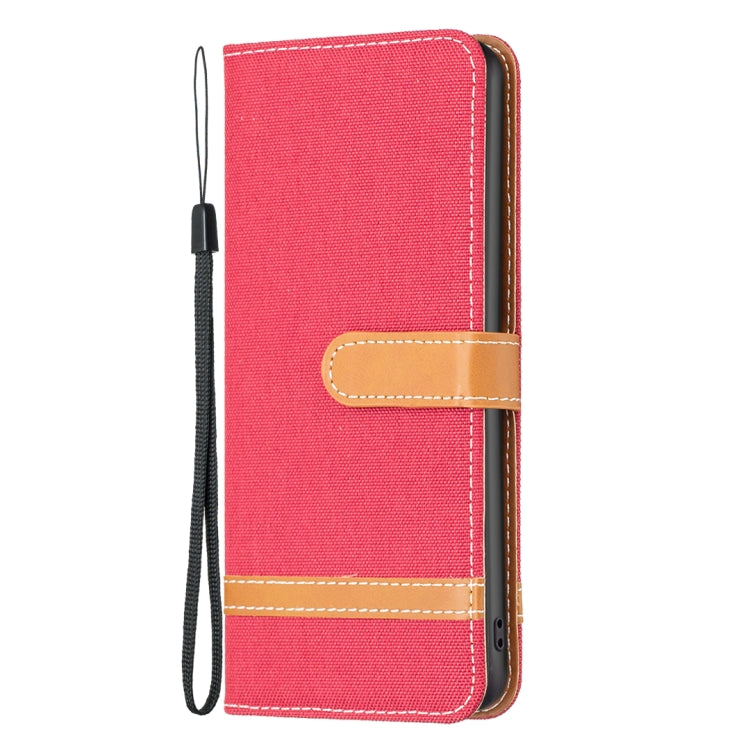 Red fabric wallet phone case with tan card slot and wrist strap