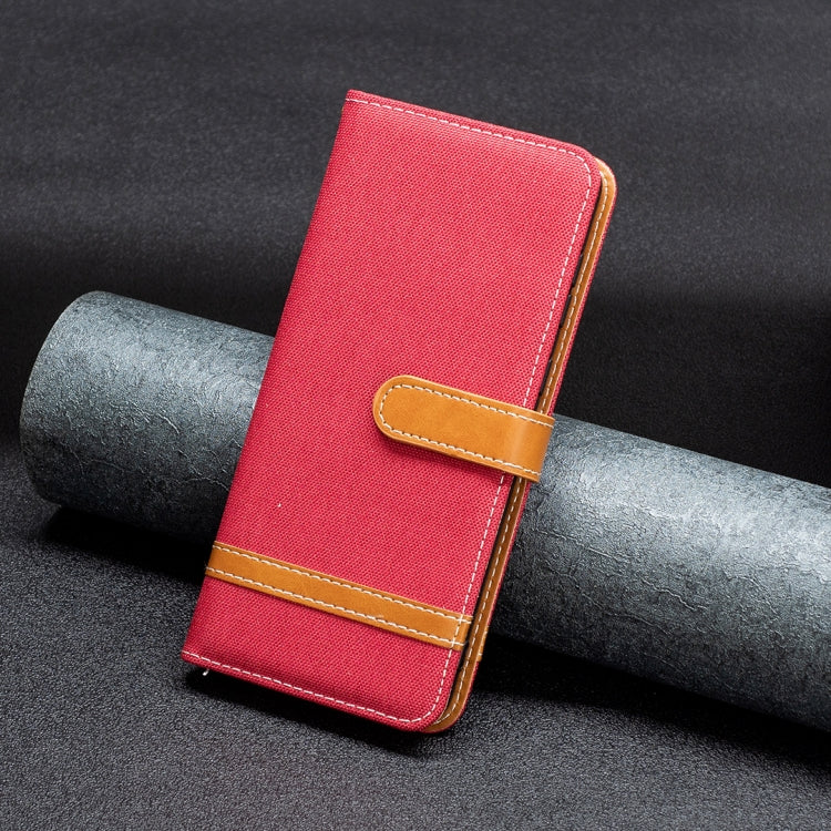 Red fabric wallet phone case with tan card slot and stitched edges