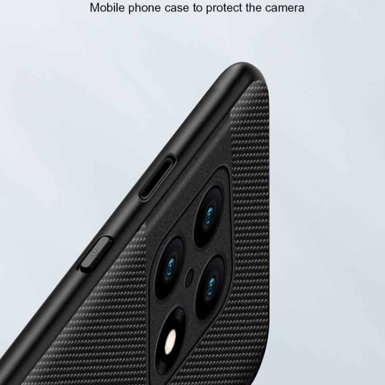 Black carbon-fiber texture phone case with camera-lens protection around bezel
