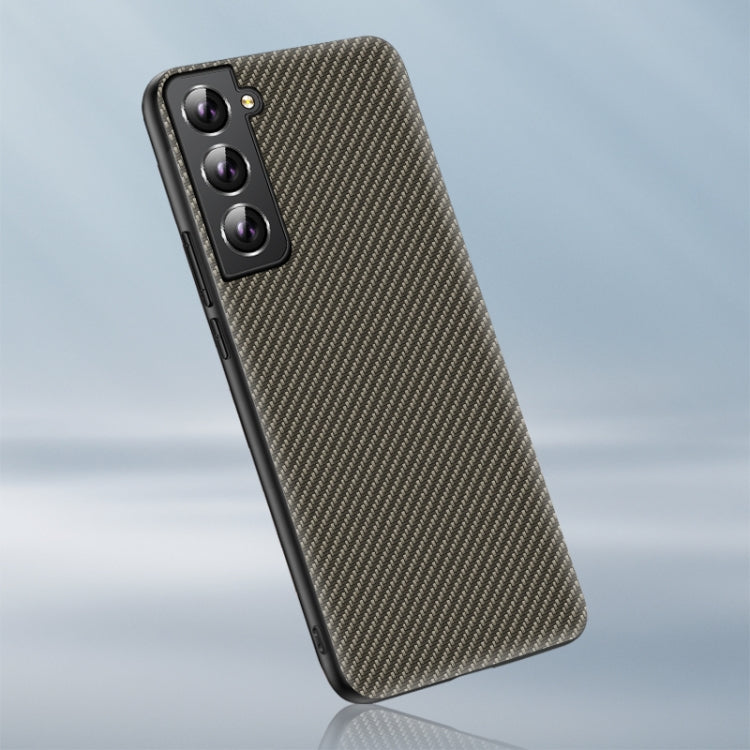 Phone case with carbon fiber texture, dark, angled back view with camera cutouts