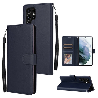 Deep navy leather phone case with three card slots and flip cover with wrist strap.