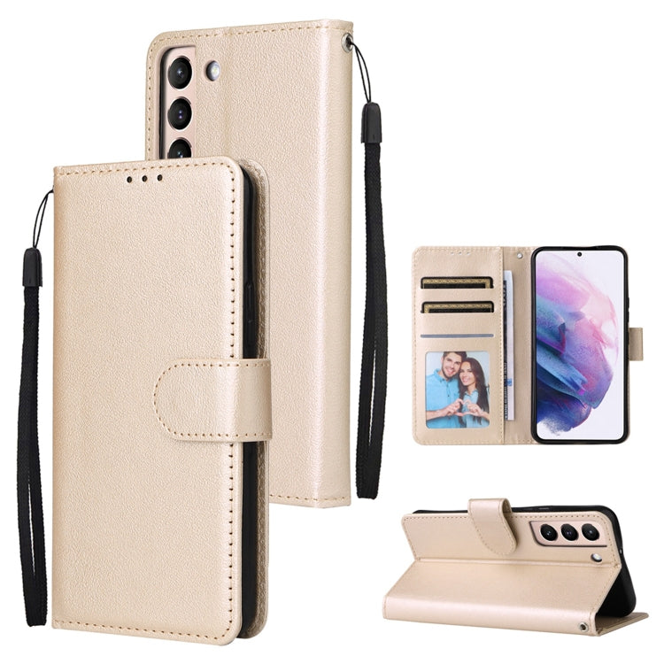 Gold-toned leather phone case with three card slots, flip cover, and wrist strap.