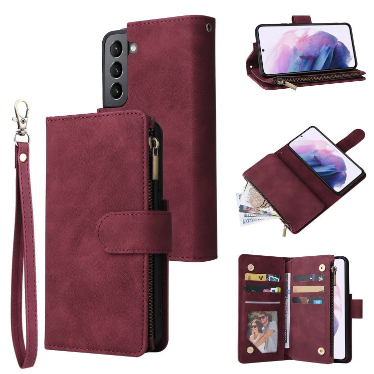 Wine red leather phone wallet case with wrist strap, zipper, and card slots