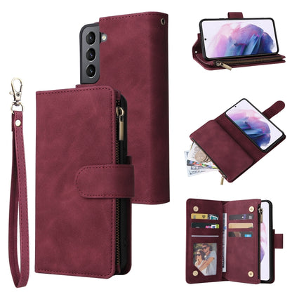 Wine red leather phone wallet case with wrist strap, zipper, and card slots