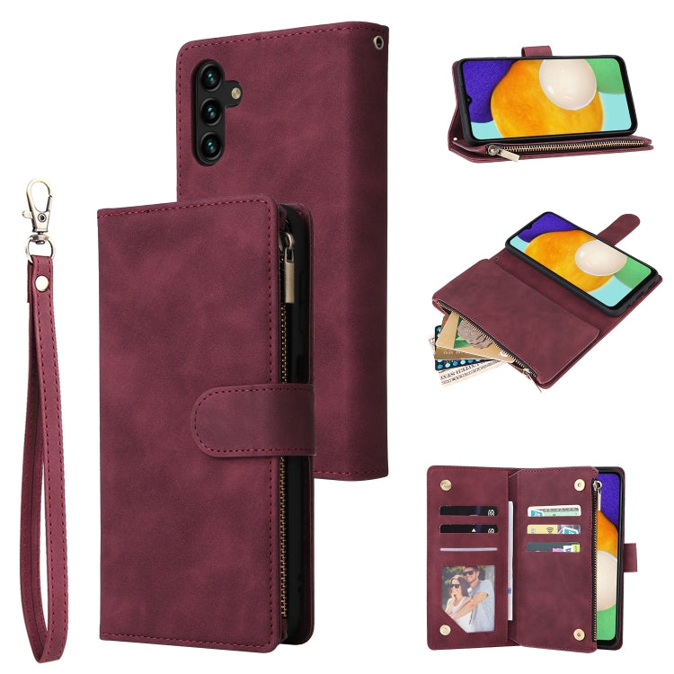 Wine red leather phone wallet case with wrist strap, zipper, and vertical card pocket