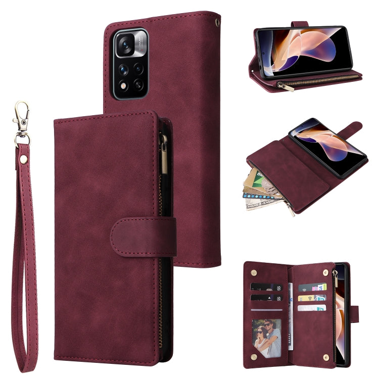 Wine red leather phone wallet case with wrist strap, zipper closure, and multiple pockets