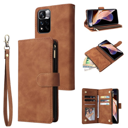 Brown leather phone wallet case with wrist strap, front flap, zipper closure, card slots