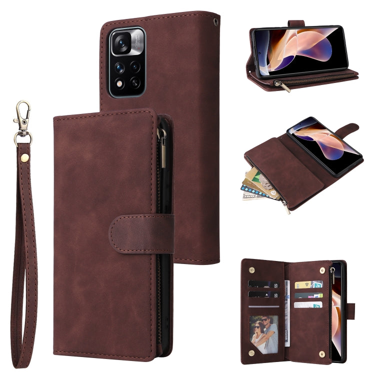 Dark brown leather phone wallet case with wrist strap, zipper closure, and card slot panel
