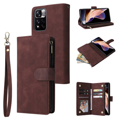 Dark brown leather phone wallet case with wrist strap, zipper closure, and card slot panel