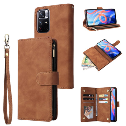 Brown leather wallet-style phone case with wrist strap, zipper closure, and card compartments
