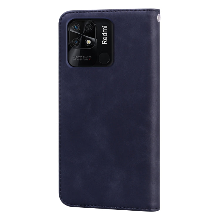 Dark blue leather phone case with camera cutout and raised stitched edges