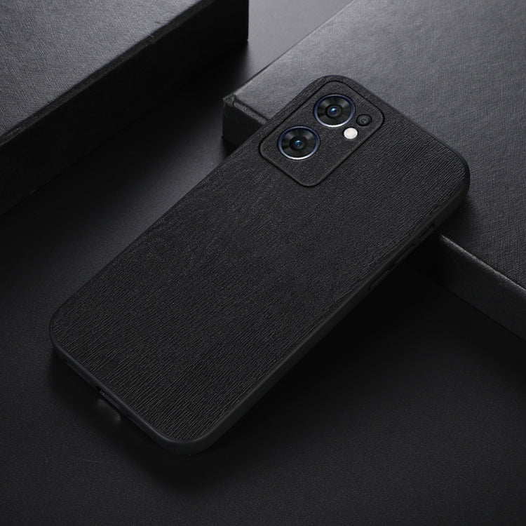Wood-texture PU phone case in black, side view with dual camera cutouts