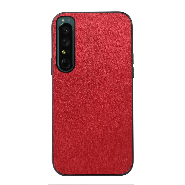 Wood-texture phone case with camera cutout and side buttons, red