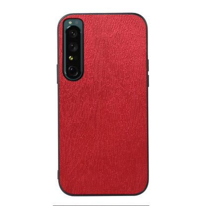 Wood-texture phone case with camera cutout and side buttons, red