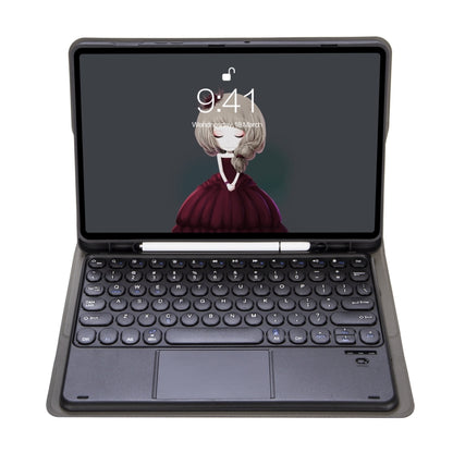 Black Bluetooth keyboard leather case with touchpad and keycaps, tablet docked in front