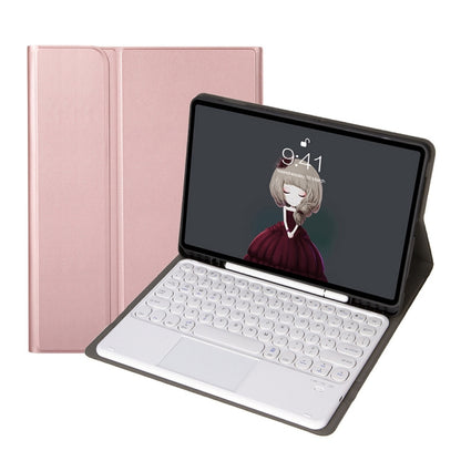 Rose pink leather folio case opened, showing Bluetooth keyboard and touchpad