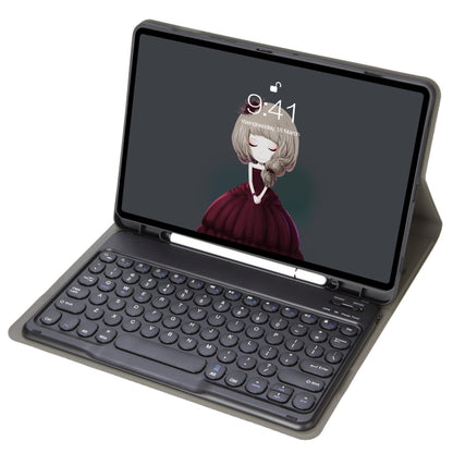 Black leather keyboard case with round keycaps, tablet in folio stand