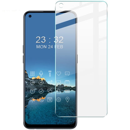 Tempered glass screen protector film on smartphone showing blue wallpaper and app icons