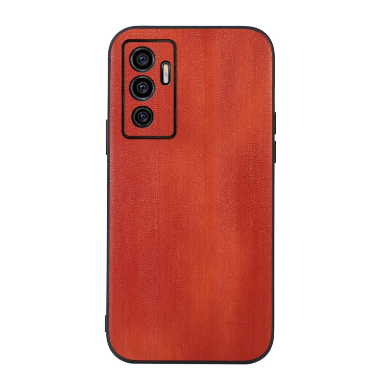 Textured PU phone case in orange-red with triple camera cutout on the back