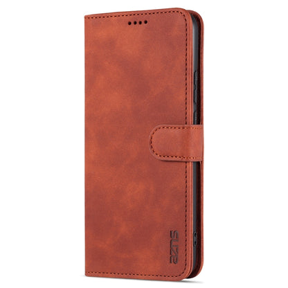 Brown leather flip phone case with side wallet flap, visible stitching, and logo panel.