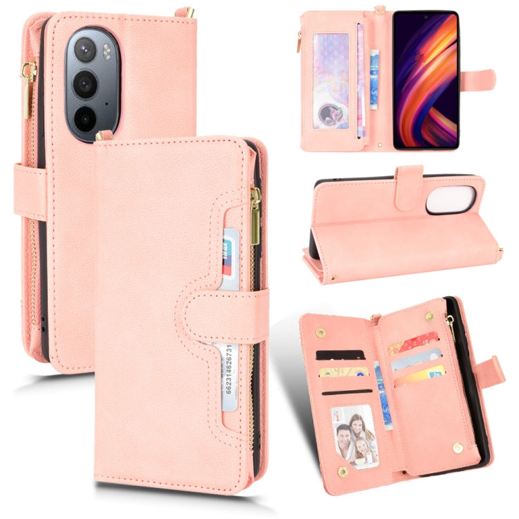 Peach-pink textured zipper wallet phone case with card slots and horizontal stand