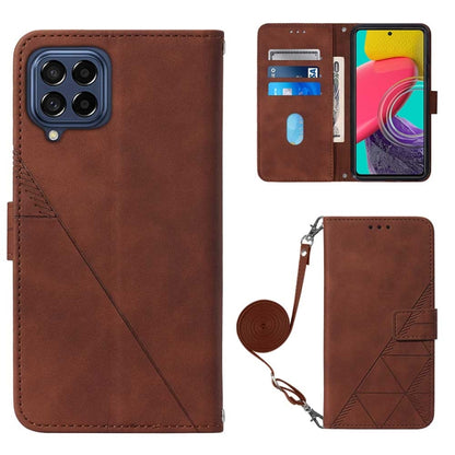 Brown flip phone case with crossbody strap and geometric back flap.