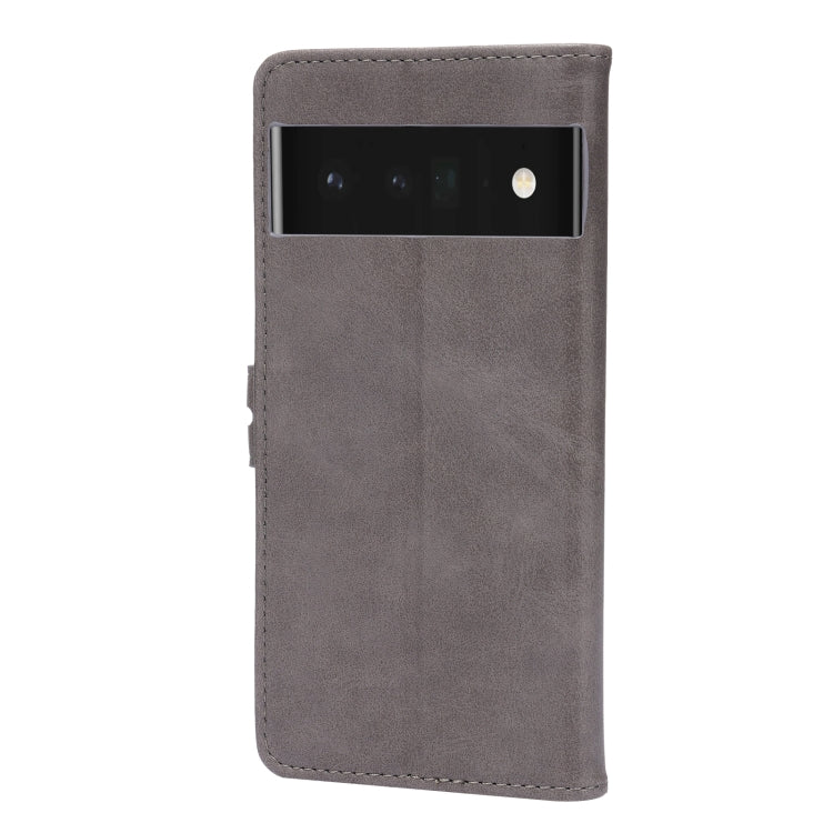 Grey faux-leather phone case with top camera cutout and cat emboss on front.