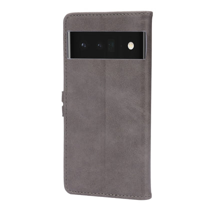 Grey faux-leather phone case with top camera cutout and cat emboss on front.