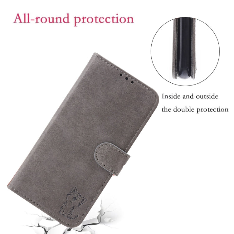 Grey folio phone case with embossed cat and front button flap; double-layer look.