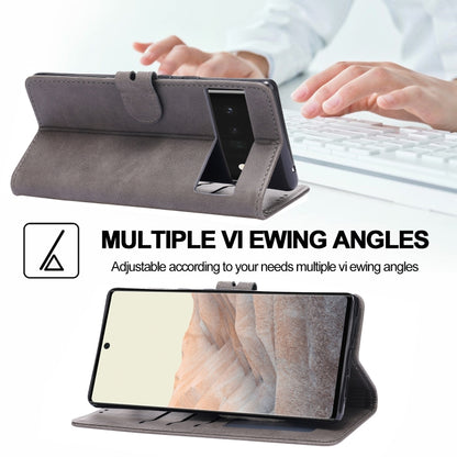Grey folio phone case in landscape stand position with front cover open.