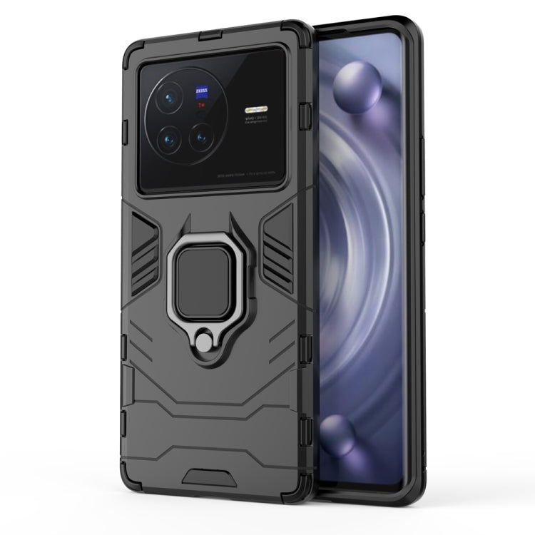 Shockproof phone case with magnetic ring holder, dark gray/black, rugged armor design.