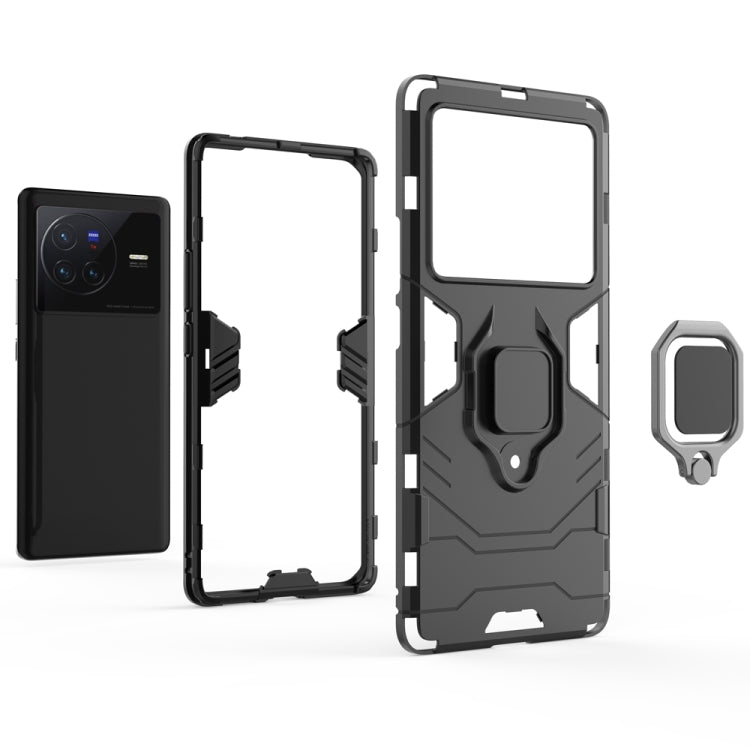 Shockproof phone case with magnetic ring holder, dark gray/black, open cutouts shown.