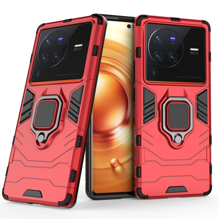 Shockproof phone case with magnetic ring holder, red, front and back with camera openings.