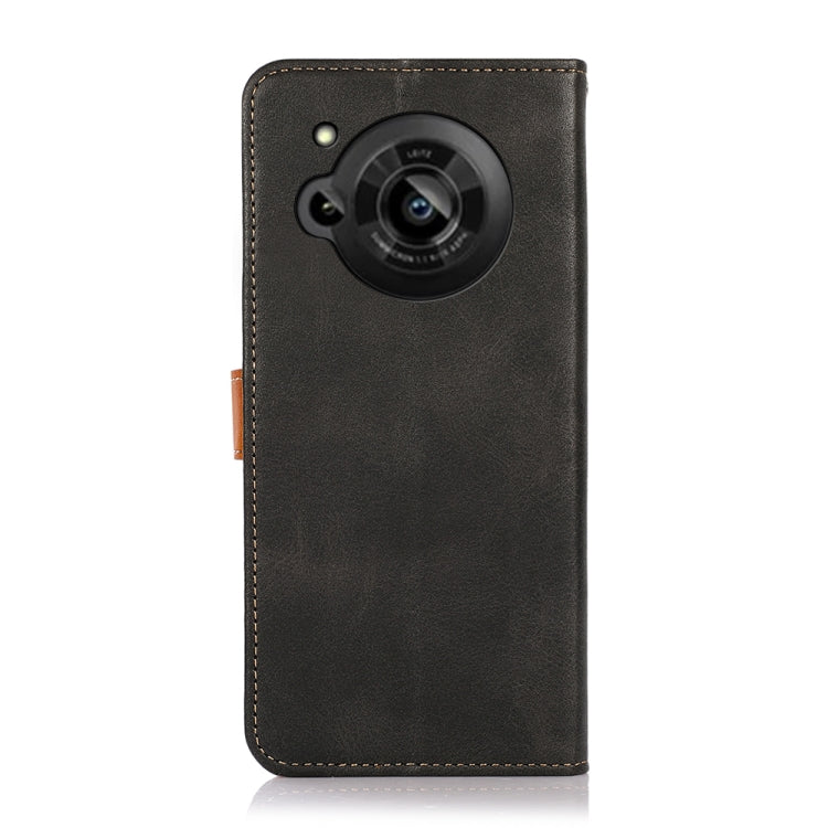 Black flip leather phone case with circular camera cutout and orange side strap