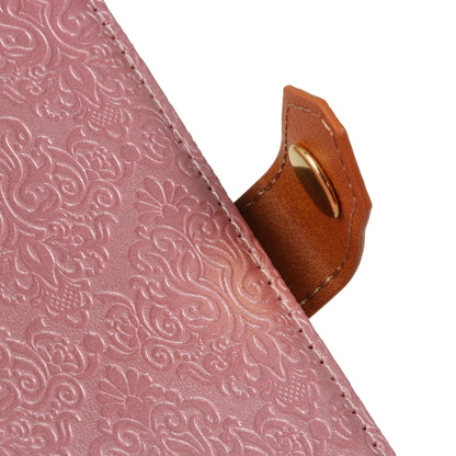 Pink embossed floral flip case edge close-up with tan clasp