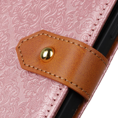 Pink embossed floral flip case with tan leather tab and gold snap button