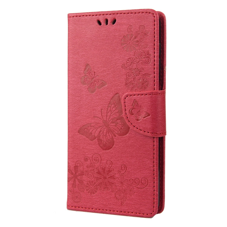 Red leather folio phone case with butterfly embossed pattern and side flip strap