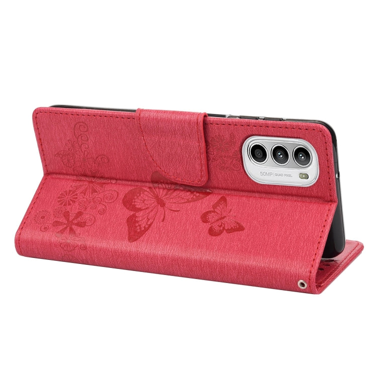 Red leather flip phone case with butterfly emboss, card flap, and camera cutout
