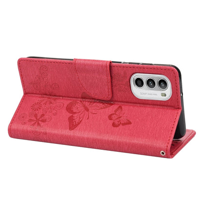 Red leather flip phone case with butterfly emboss, card flap, and camera cutout