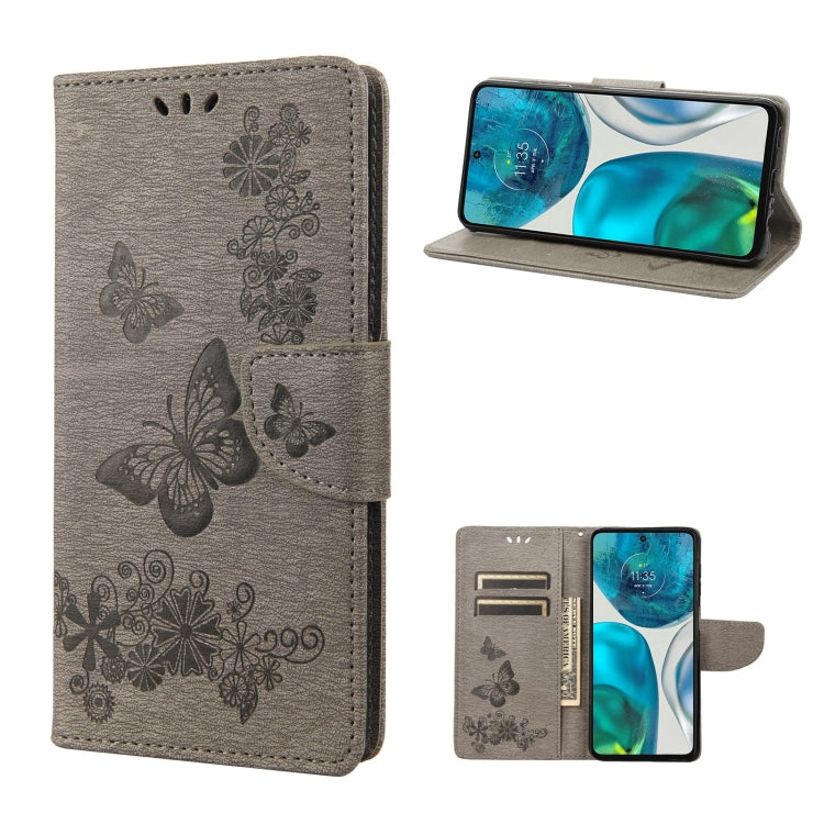 Gray leather flip phone case with butterfly emboss, side strap, and camera cutout
