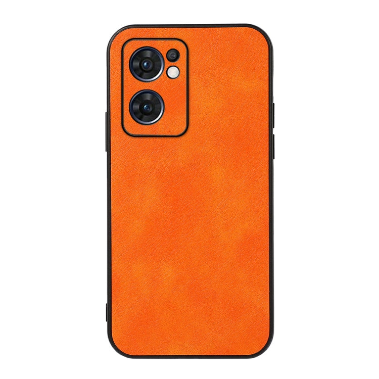 Two-tone PU litchi-texture phone case, orange; raised camera cutout on back.