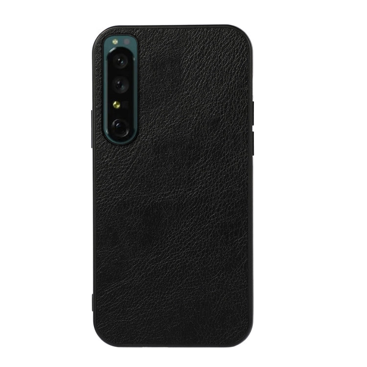 Two-tone PU litchi-texture phone case, black; camera module cutout and ports.